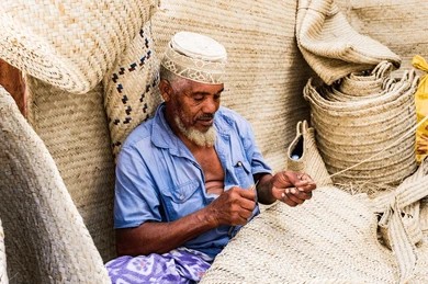 Traditional craftsman preserving Swahili heritage through basket weaving